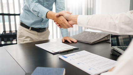 Recruitment concept, Male employer shaking hands with applicant to congratulation for new job