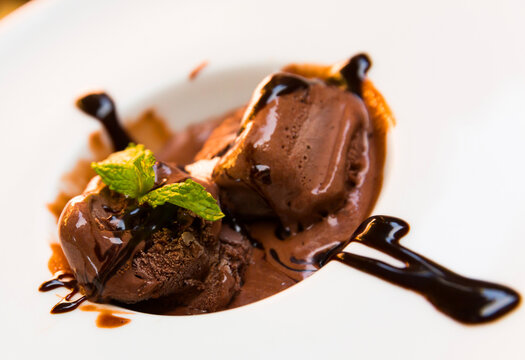 Image of homemade chocolate ice cream with chocolate cream and mint