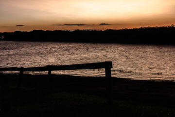 Fototapeta na wymiar view of sunset in the Jurumirim lake dam water reservoir in Avare, state of Sao Paulo