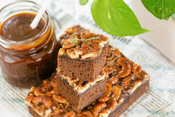 Close up stack of golden brown square slice toffee cake combination chocolate and coffee cake...