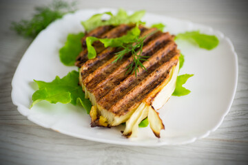 piece of grilled baked cabbage with spices in a plate