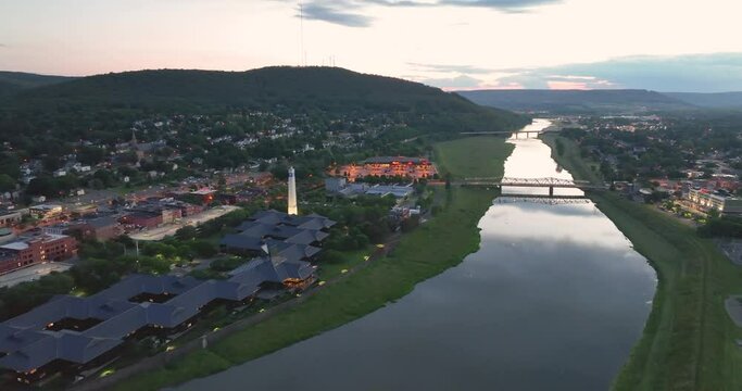 Early evening spring, summer aerial video of area around Corning New York