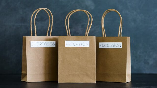 economy after covid, inflation shortages and recession texts on shopping bags