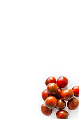 Closeup of fresh juicy organic red cherry tomatoes from the garden on isolated white background from above