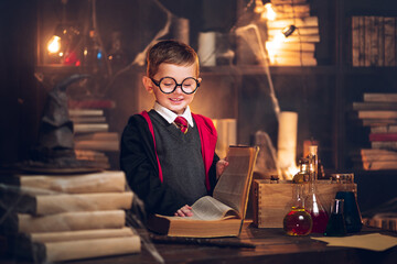Small smiling wizard reads magic book Cosplay. Halloween holiday. Halloween costume party