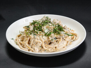 Spaghetti with cream sauce and herbs