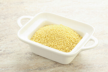 Raw couscous in the bowl