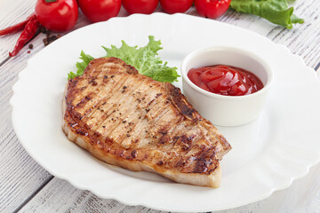 Grilled pork steak with ketchup