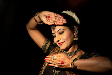 Indian woman Odissi dancer doing classical dance form. Orissi dance. art and culture of india.