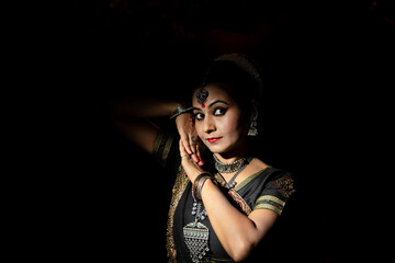 Indian woman Odissi dancer doing classical dance form. Orissi dance. art and culture of india.