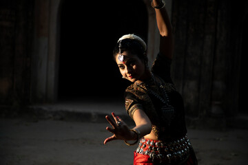 Indian woman Odissi dancer doing classical dance form. Orissi dance. art and culture of india.