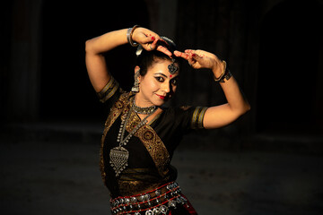 Indian woman Odissi dancer doing classical dance form. Orissi dance. art and culture of india.
