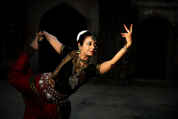 Indian woman Odissi dancer doing classical dance form. Orissi dance. art and culture of india.