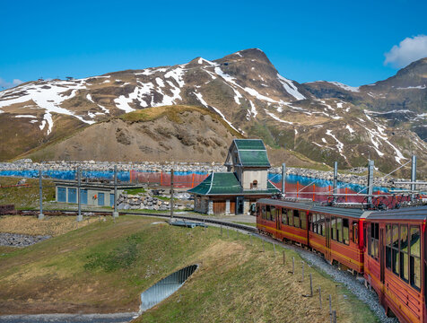  Red train to Jungfraujoch  over Swiss Alps.