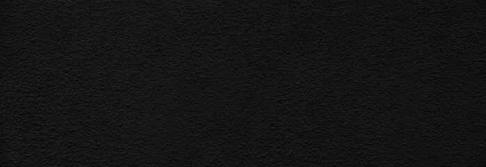 rough black plaster on the wall for background