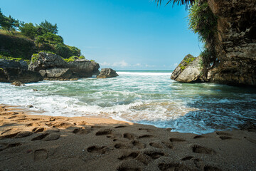 Fototapeta premium South Beach in Yogyakarta, Indonesia, which is famous for its big waves and big corals, is a popular tourist attraction