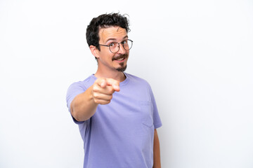 Young man with moustache isolated on white background pointing front with happy expression