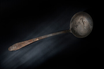 old ladle on a dark background