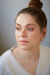 Focused thinking woman face portrait. Girl looking away. Female head shot with shallow depth of...