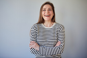 Obraz premium Smiling woman wearing casual standin with crossed arms looking away. isolated portrait of happy girl.