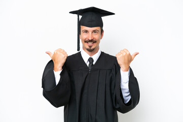 Young university graduate man isolated on white background with thumbs up gesture and smiling