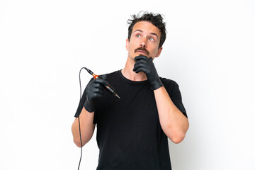 Tattoo artist man isolated on white background and looking up