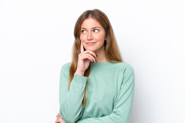 Young caucasian woman isolated on white background thinking an idea while looking up