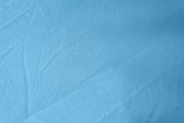 Old used Creased empty light Blue color tone bedsheet cloth texture minimalist background
