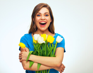  portrait of happy woman with big smile holding tulips.