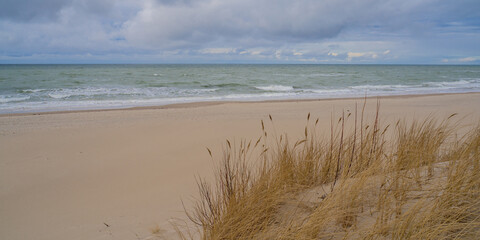 Fototapeta na wymiar Seashore warm afternoon sandy beach