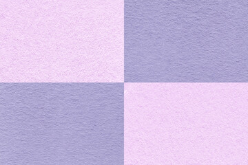 Fototapeta premium Texture of craft purple and lilac paper background with cells pattern, macro. Structure of vintage violet cardboard.