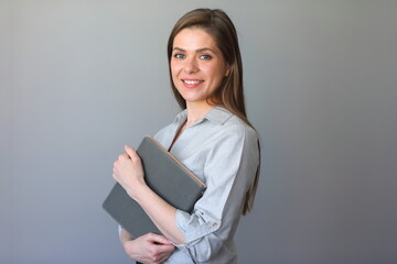 Student girl or teacher woman holding book.