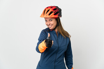 Middle age cyclist woman isolated on white background with thumbs up because something good has happened
