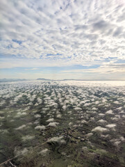 cloud view over land. view from airplane window.