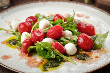 Closeup on cherry tomato and mozzarella cheese salad