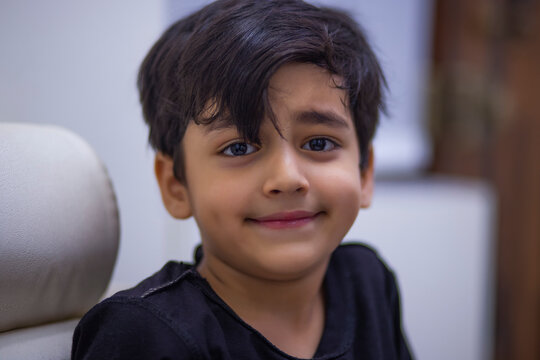 Close-up portrait of a boy child looking at camera