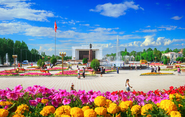 Beautiful view of Ala-Too Square, Kyrgyz Historical Museum, walking local people and blue sky in...