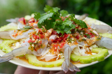 Shrimp in fish sauce with green rest on plate - Asian style