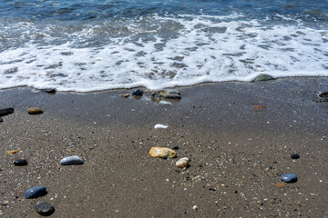 Fototapeta na wymiar sea wave breaking on the shore of the beach