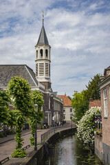 The Onze Lieve Vrouw ten Hemelopneming with white tower, better known as Elleboogkerk, was built in 1783 for one of the four Catholic stations. Amersfoort, the Netherlands.