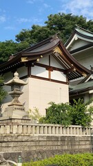 The rooftop decor and stone lantern of ancient Japanese shrine house, Ueno park 