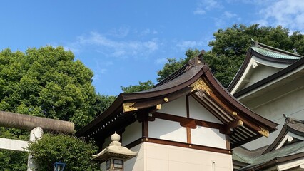 The rooftop decor and stone lantern of ancient Japanese shrine house, Ueno park 
