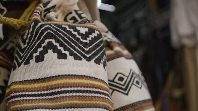 A closeup of street selling in Cartagena de Indias of traditional bags hand knitted by women of the Wayuu community in Colombia called Mochilas Wayuu.