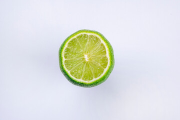 half lime isolated on white background close up 
