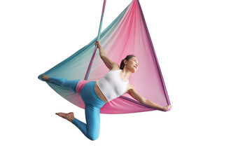 Mature woman pose in hammock performing aerial yoga or flying yoga exercise isolated on white background. Healthy lifestyle and emotional health of middle aged people