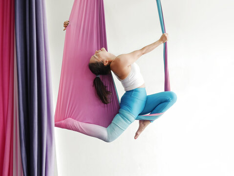 Premium Photo  Yoga in a hammock girl / concept sport active lifestyle.  young coach doing yoga in a hammock, gym, fitness, training in a hammock