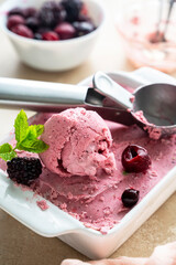 Pink ice cream scoop close up. Homemade pink healthy sorbet with banana and berry, ice cream refresing treat