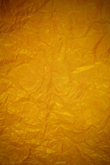 Crumpled gold paper recycling background.