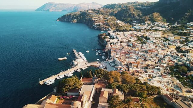 Aeolian Islands. Lipari town aerial view with drone overlooking to other islands: Hovering on Lipari city centre, Lipari's castle and Canneto's beach