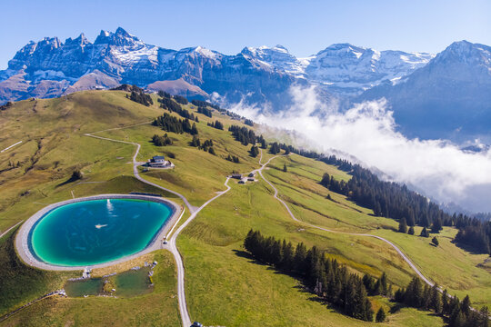 Aerial view of an artificial lake on mountain top in Champ&eacute;ry, Valais, Switzerland.